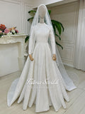 Shimmering white hijab wedding dress with beaded lace veil, high neck