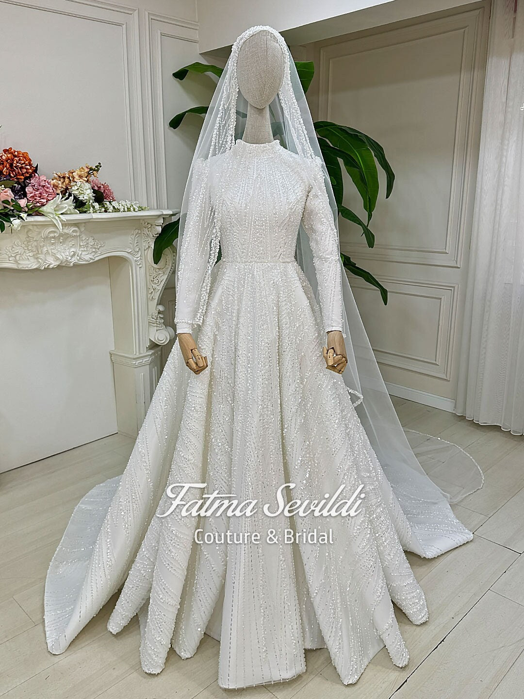 Shimmering white hijab wedding dress with beaded lace veil, high neck