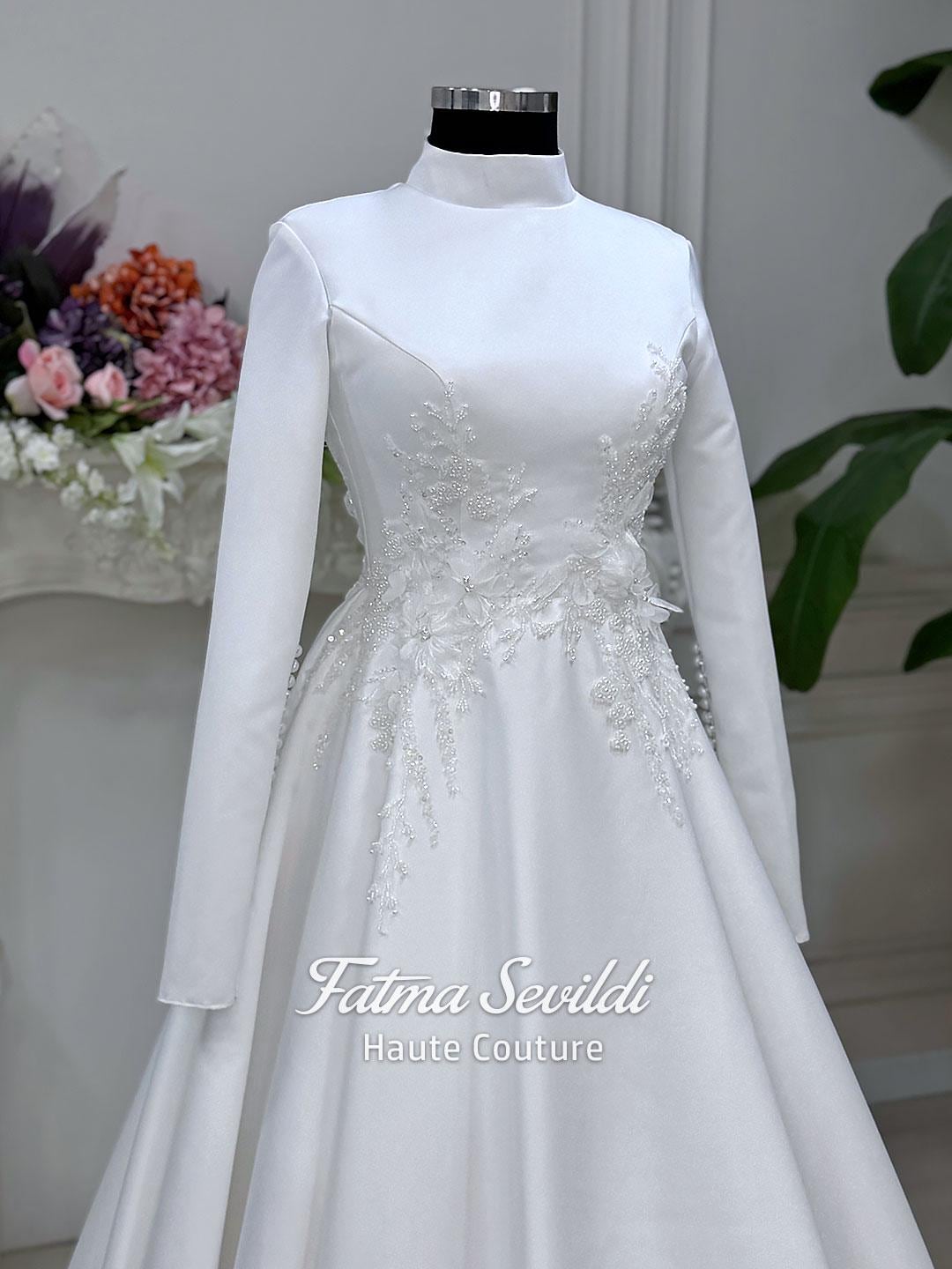 Elegant white satin Veiled 3D floral hijab wedding gown with silver beaded embroidery