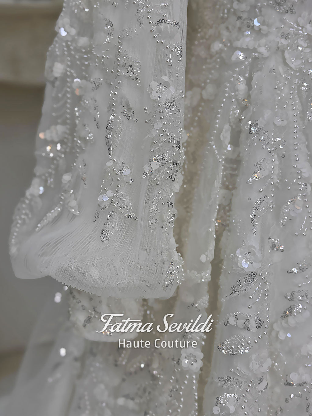 Luxury Muslim wedding dress with high neck, long sleeves, beaded lace embroidery, full A-line skirt, and matching premium lace veil. Elegant modest bridal gown custom made for hijab brides seeking a couture wedding look.