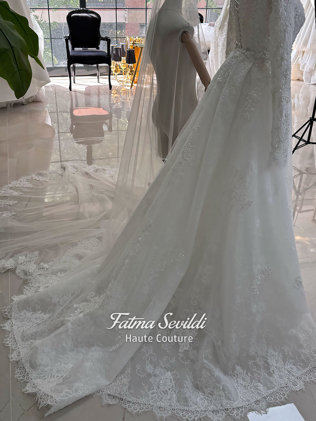 Luxury hijab wedding dress with long sleeves, high mock neck, floral lace embroidery, detachable mermaid skirt, dramatic train and premium lace veil for a modest Muslim bride.