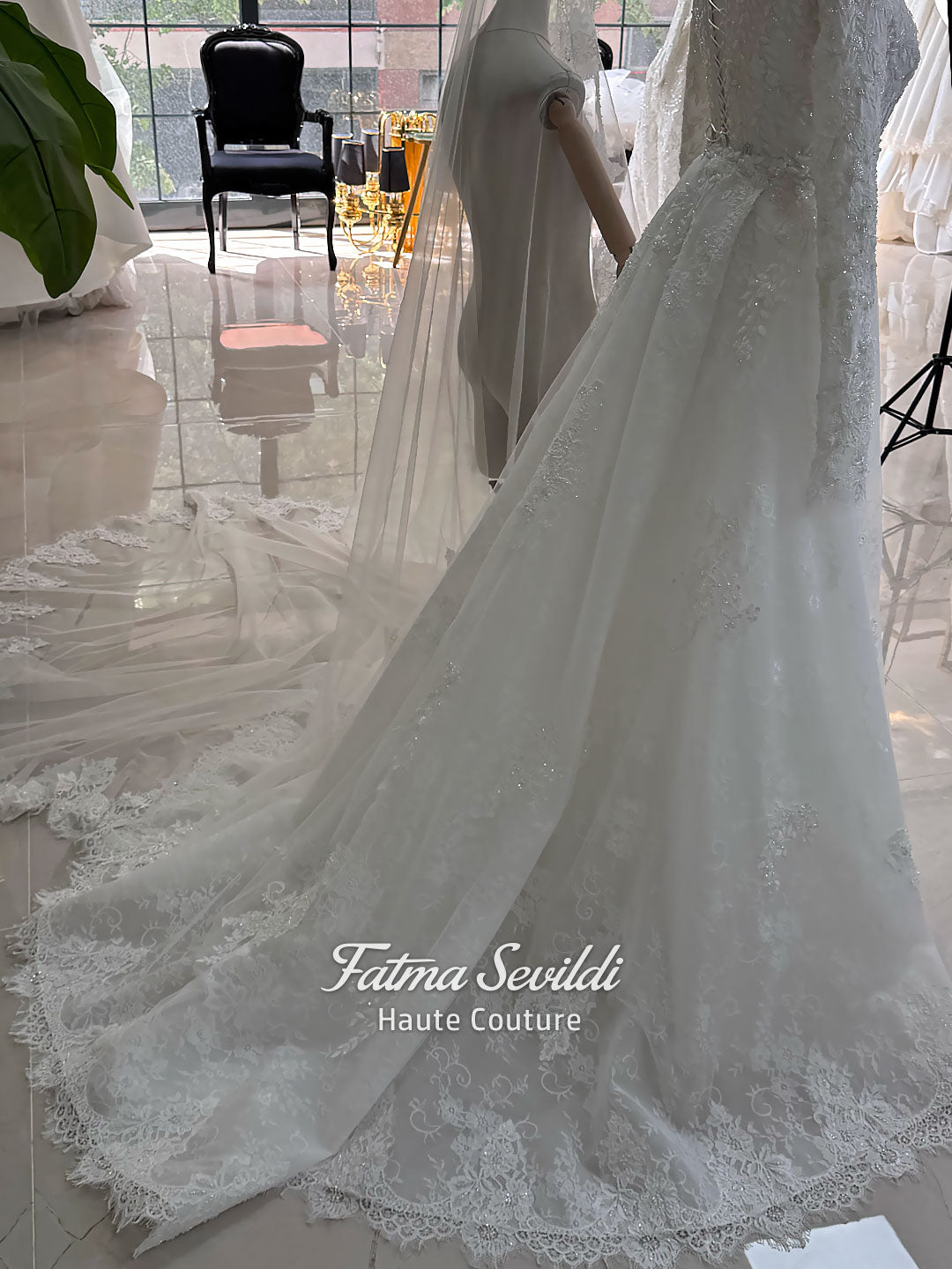 Luxury hijab wedding dress with long sleeves, high mock neck, floral lace embroidery, detachable mermaid skirt, dramatic train and premium lace veil for a modest Muslim bride.