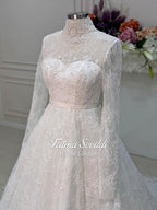 Elegant strapless lace wedding gown with floral embroidery, beaded details, corset back, and veil