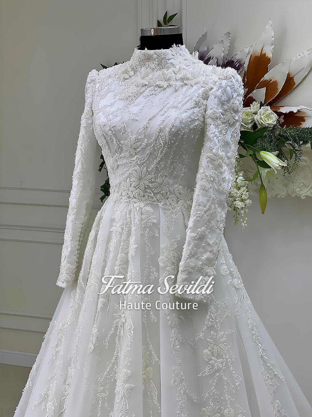 Elegant veiled Muslim wedding dress with high neck, beaded lace, long sleeves