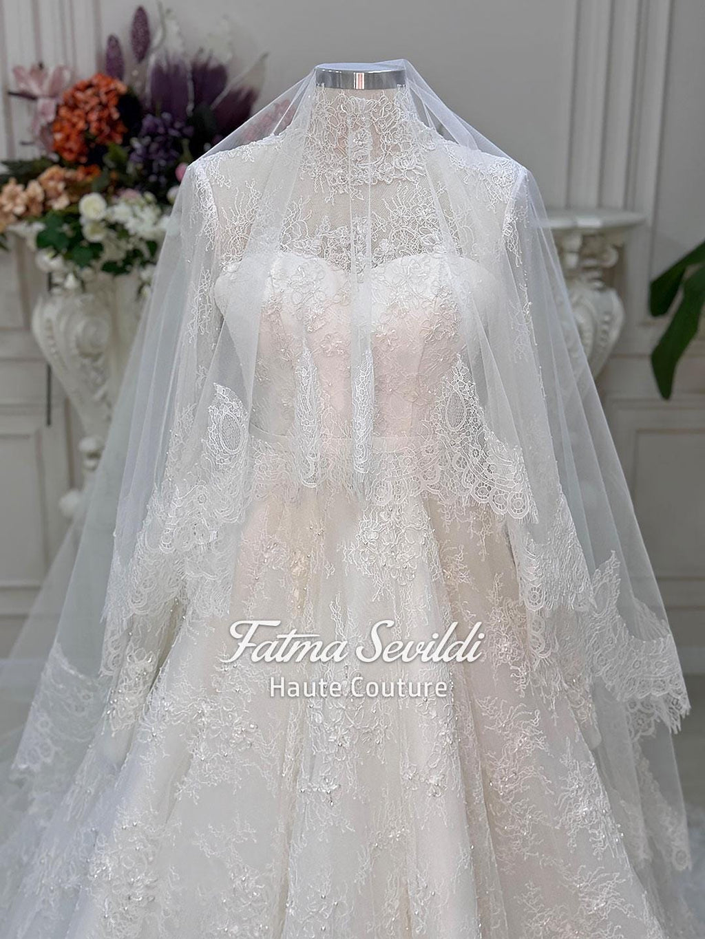 Elegant strapless lace wedding gown with beaded French lace, corset back and veil