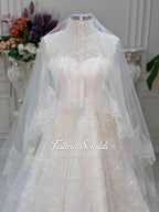 Elegant strapless lace wedding gown with beaded French lace, corset back and veil