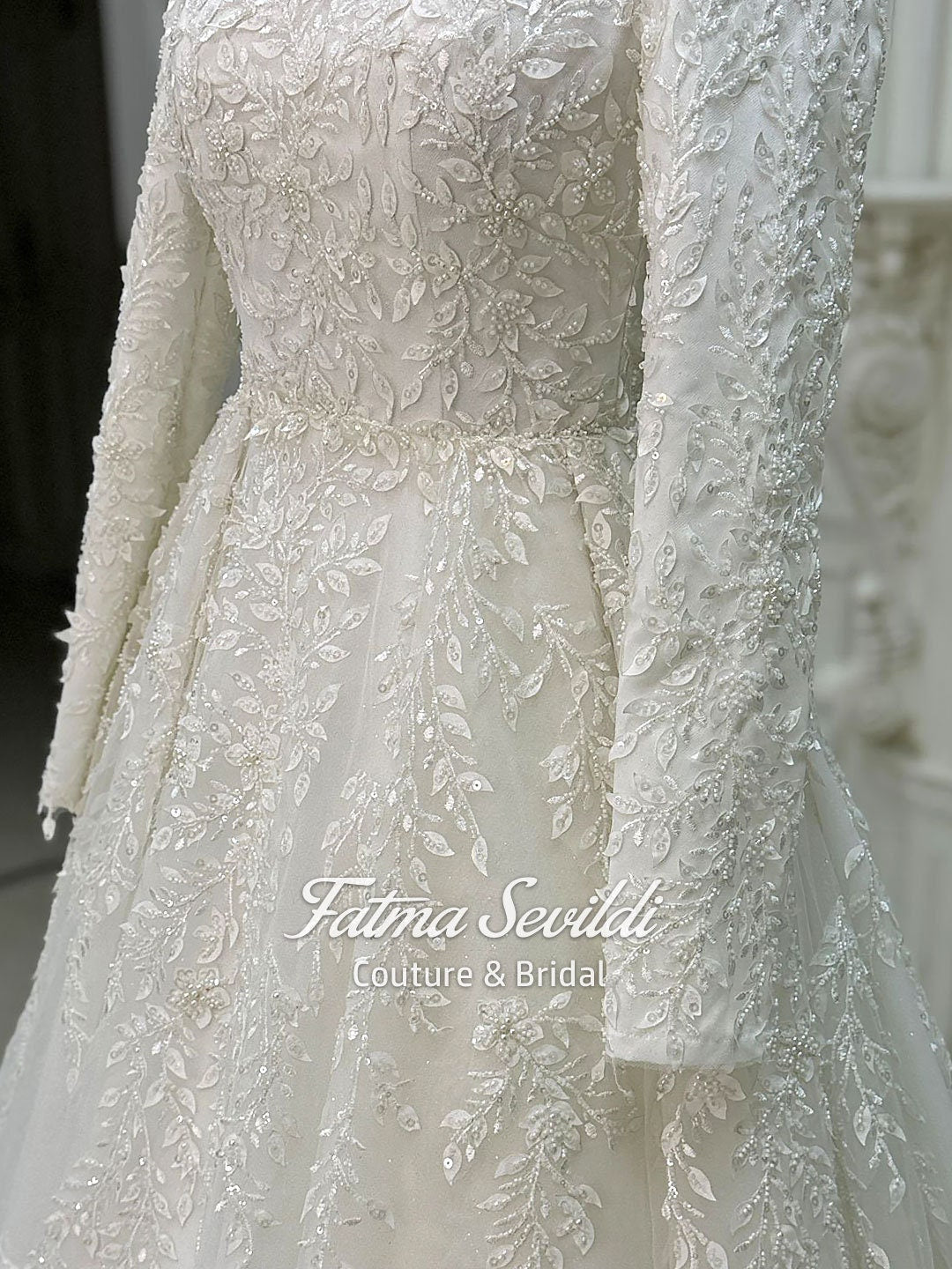 Elegant veiled hijab ivory wedding gown with silver leaf embroidery
