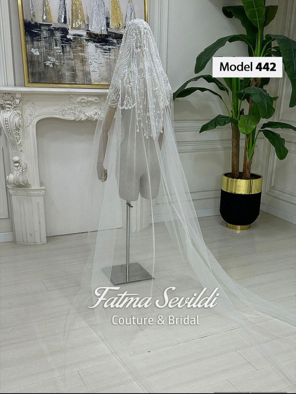 Delicate white beaded Muslim bridal veil with lace details and train