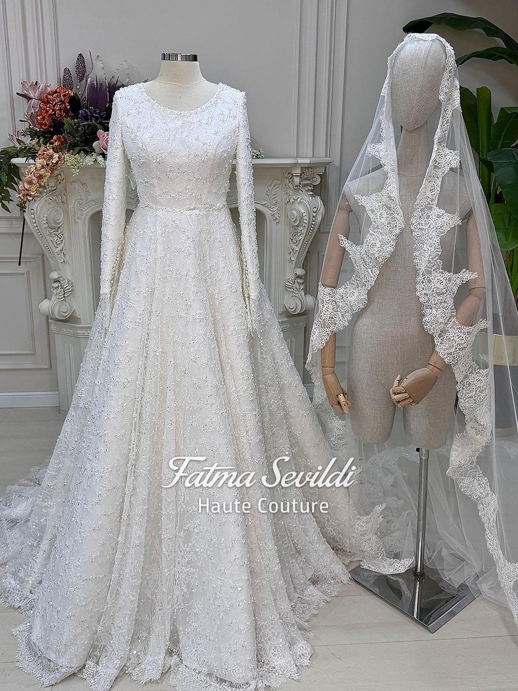 Elegant veiled A-line wedding dress with full beaded long sleeves
