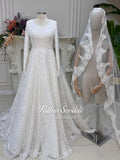Elegant veiled A-line wedding dress with full beaded long sleeves