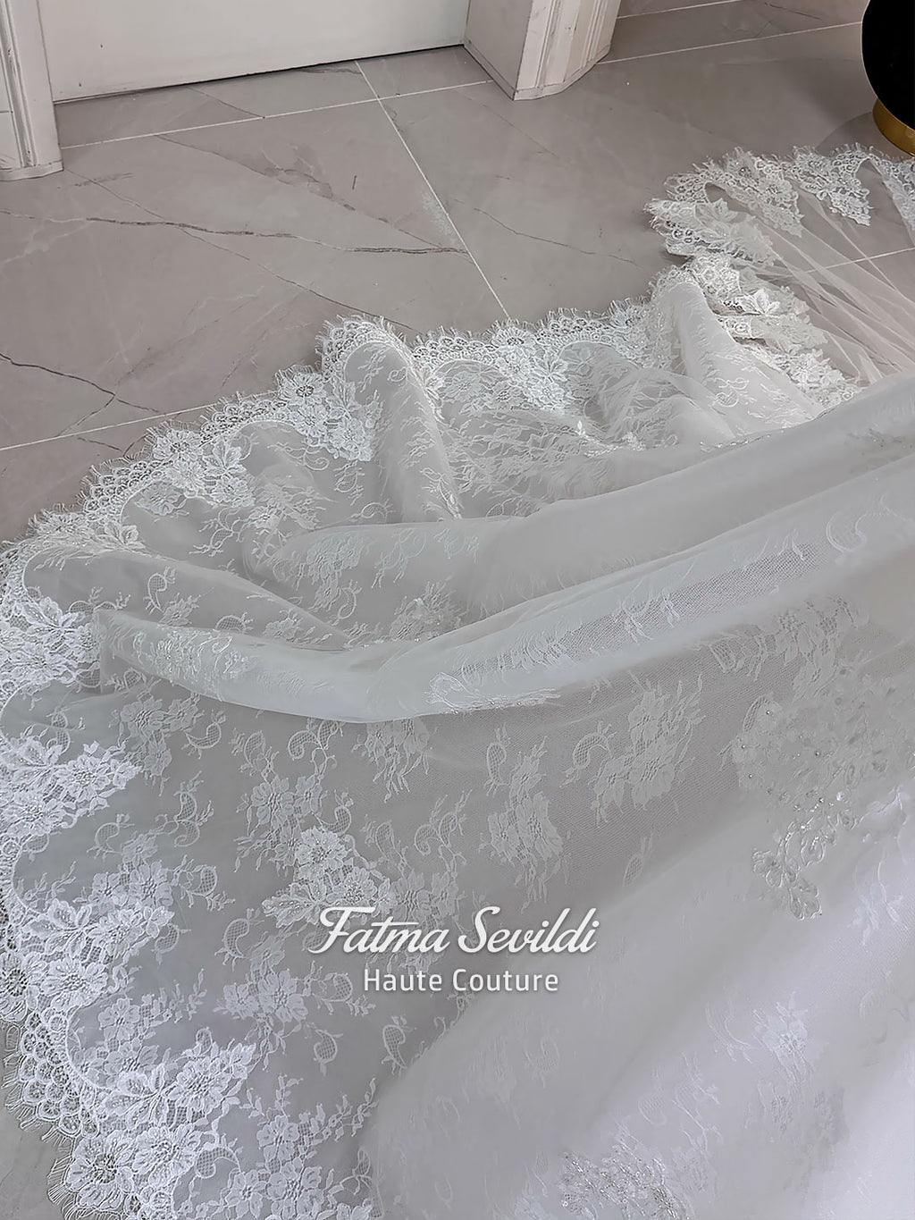 Luxury hijab wedding dress with long sleeves, high mock neck, floral lace embroidery, detachable mermaid skirt, dramatic train and premium lace veil for a modest Muslim bride.