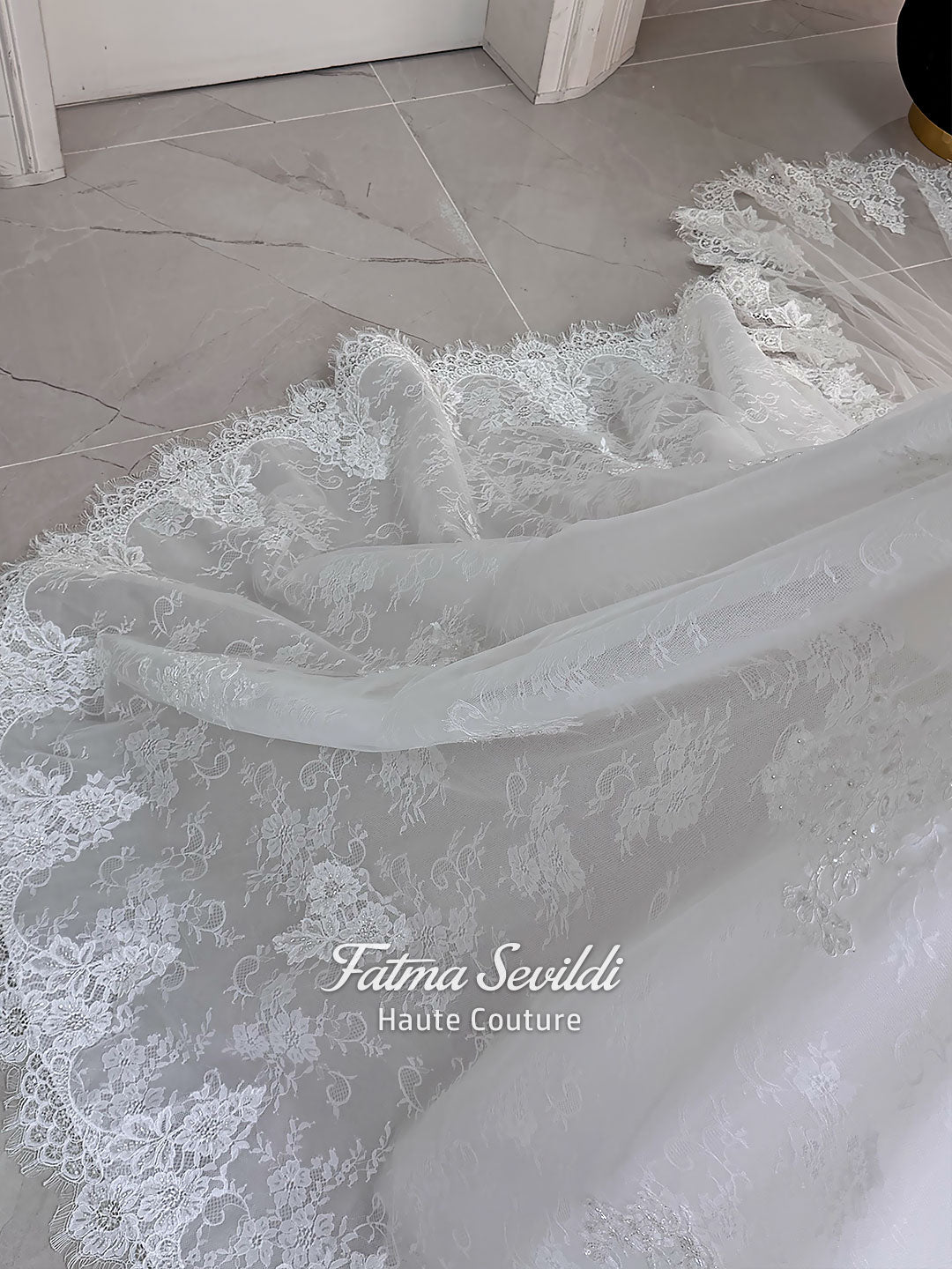 Luxury hijab wedding dress with long sleeves, high mock neck, floral lace embroidery, detachable mermaid skirt, dramatic train and premium lace veil for a modest Muslim bride.