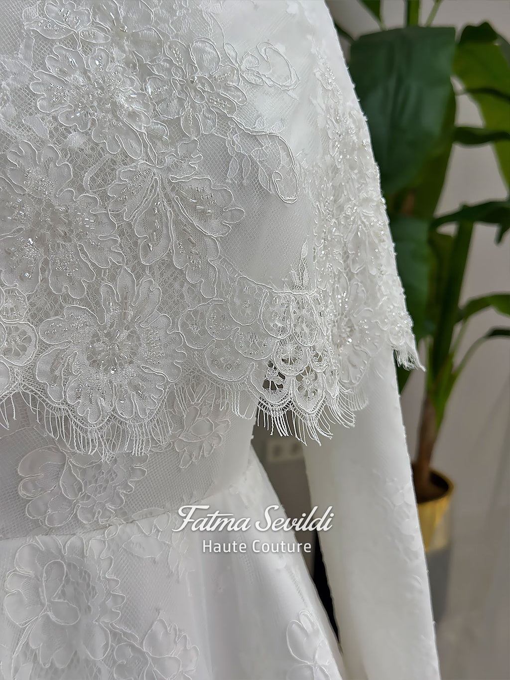 Elegant hijab wedding dress with long sleeves, high neck, detachable lace cape, cathedral train, and premium lace veil included. Luxury modest bridal couture gown in white with floral lace detailing.