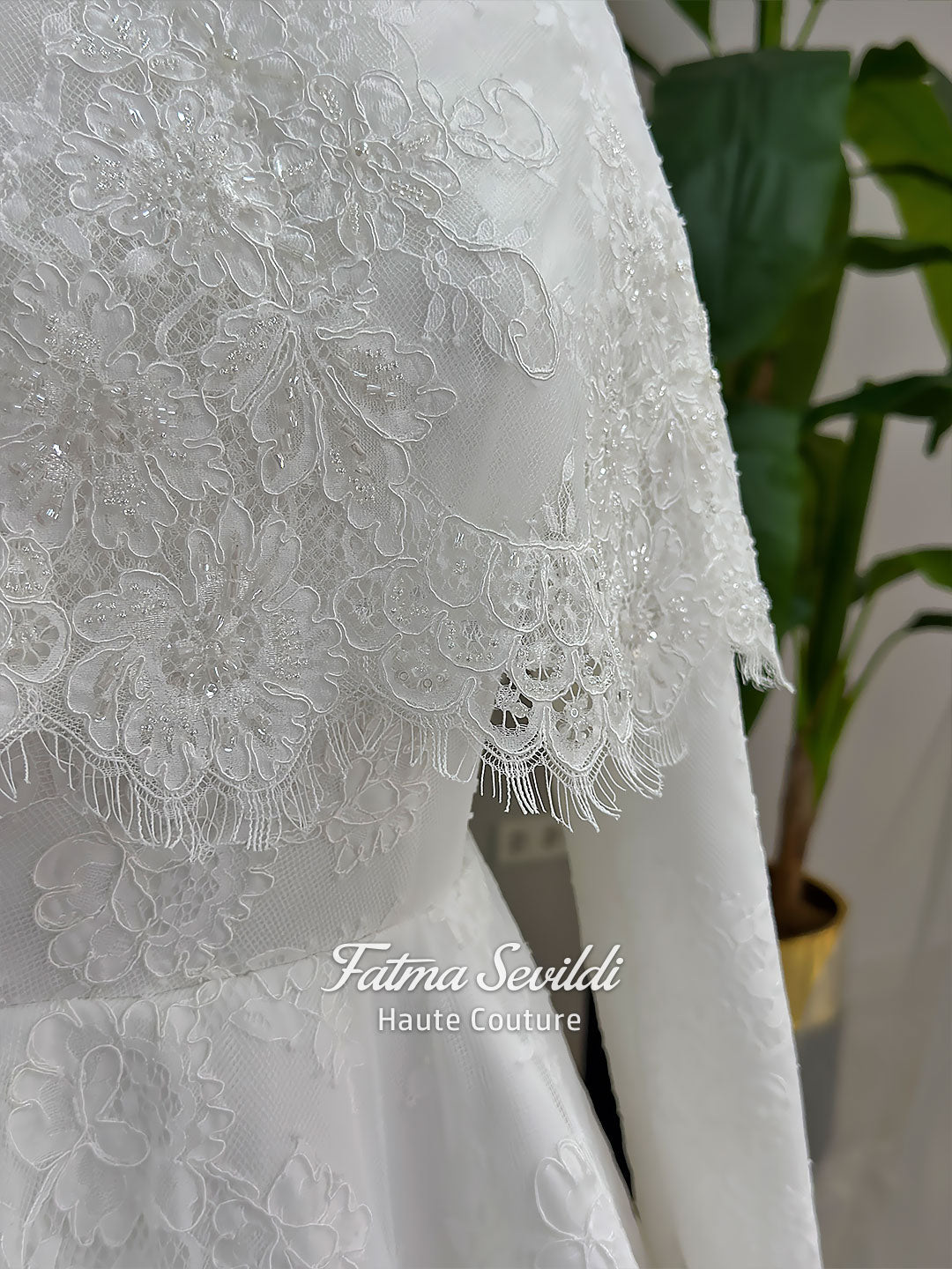 Elegant hijab wedding dress with long sleeves, high neck, detachable lace cape, cathedral train, and premium lace veil included. Luxury modest bridal couture gown in white with floral lace detailing.