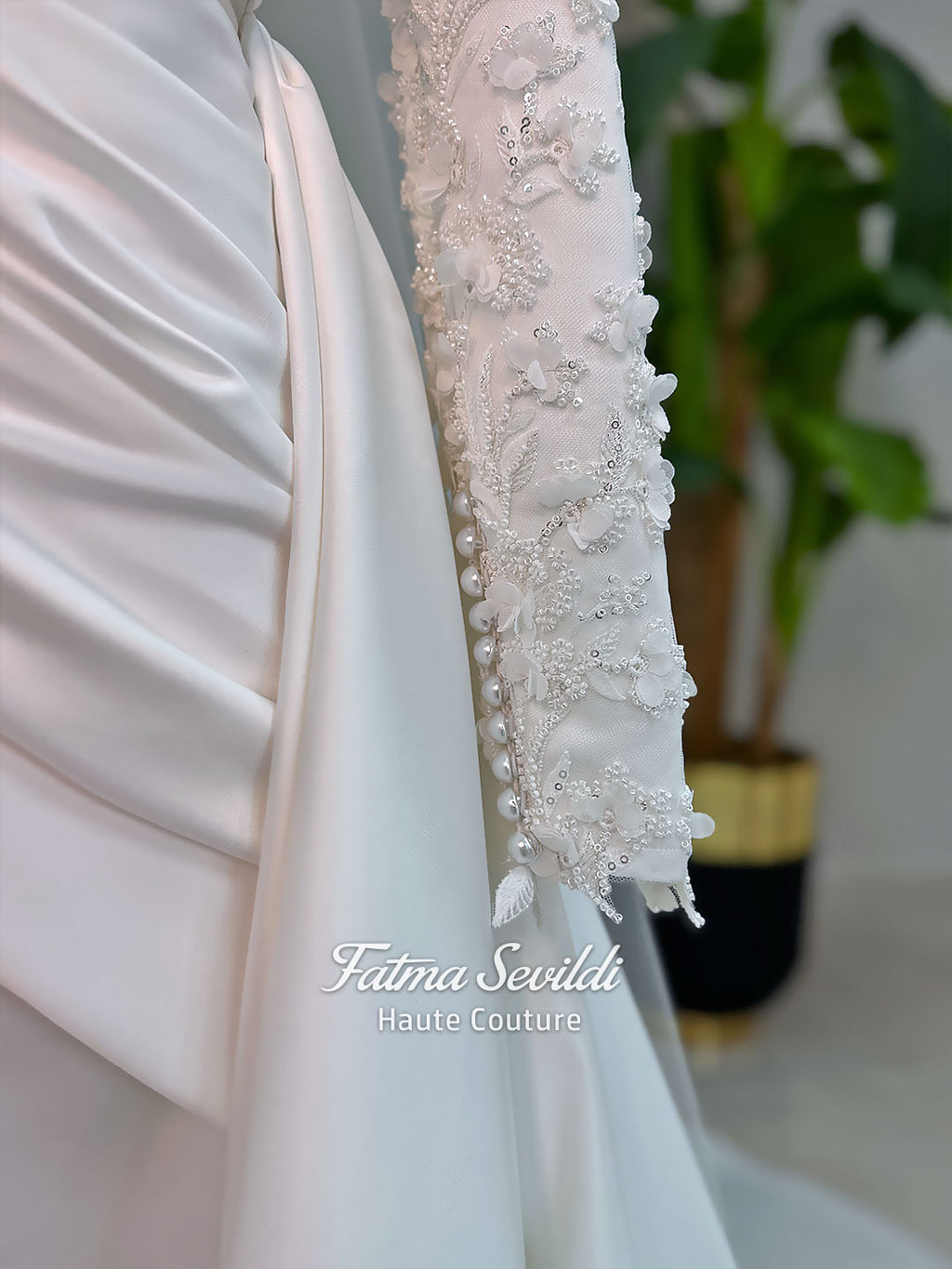 Luxury modest hijab wedding dress with long sleeves, 3D floral beaded lace bodice, draped satin A-line skirt and lace-edged veil included, shown on mannequin. Custom made Islamic bridal gown with elegant full coverage.