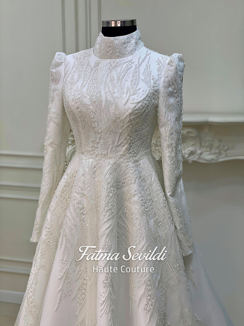 Luxury hijab wedding dress with high neck and long sleeves, featuring elegant beaded lace over a satin A-line silhouette for a modest bridal look.