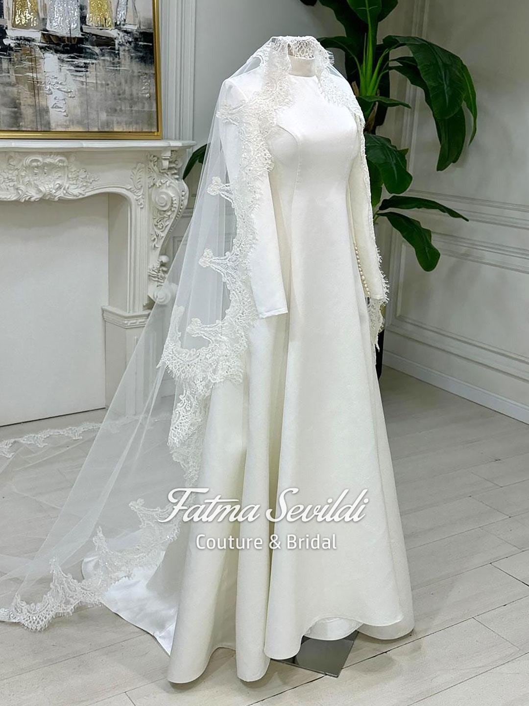 Elegant veiled hijab satin A-line wedding gown with lace sleeves and pearl veil