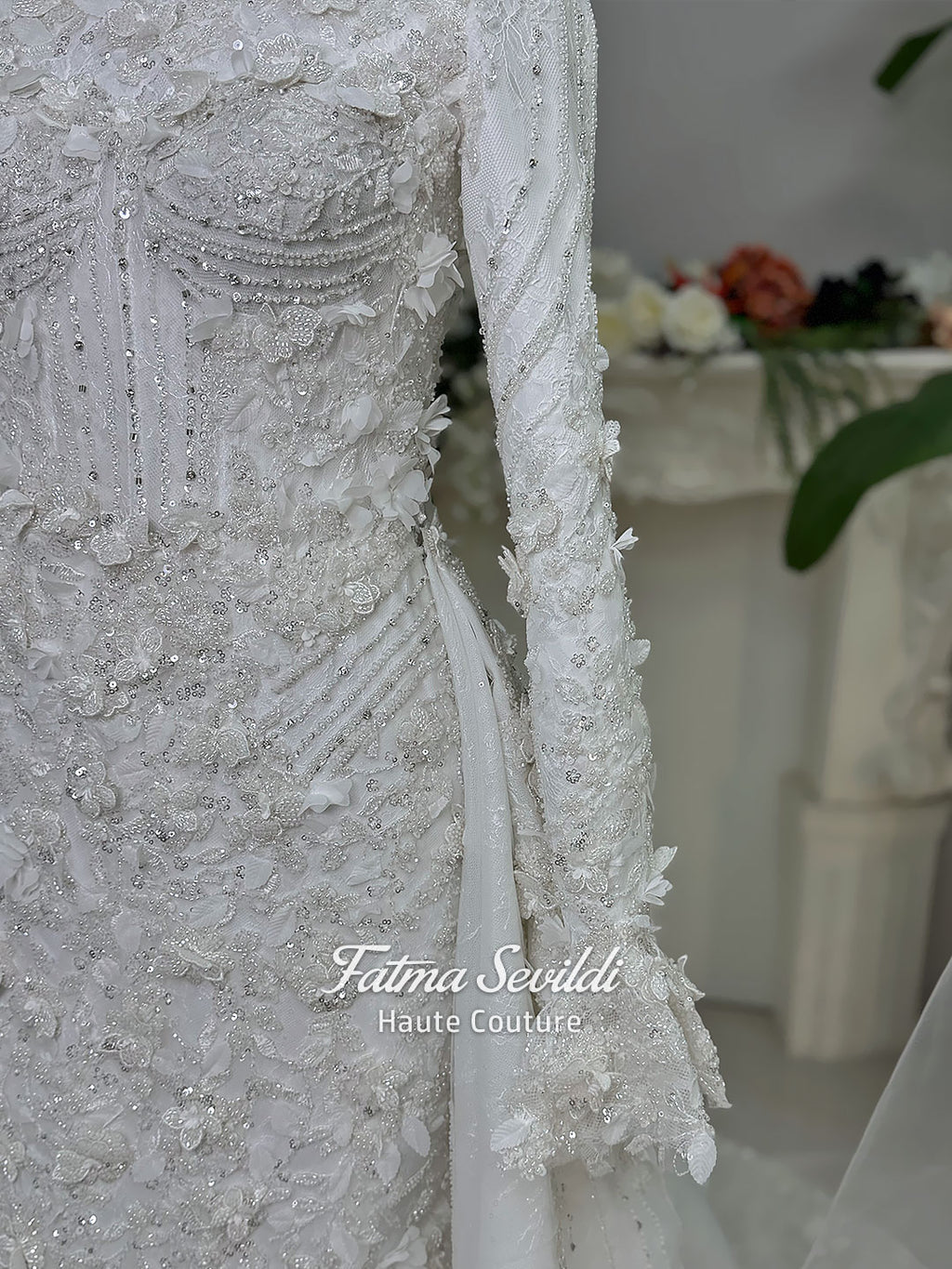 3-in-1 white hijab wedding dress with a beaded mermaid gown, detachable overskirt and long sleeve high-neck bridal topper. Convertible modest bridal set with dimensional floral lace and a coordinating lace veil.