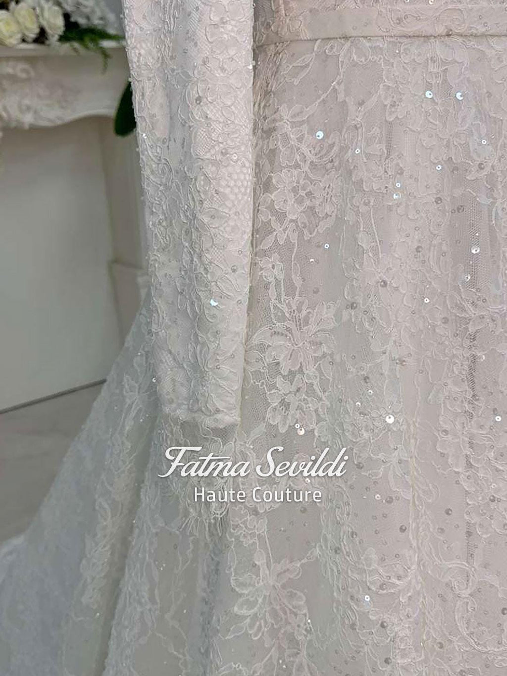Delicate ivory veiled hijab wedding dress with beaded lace, long sleeves, high neck, floral patterns and sparkling sequins