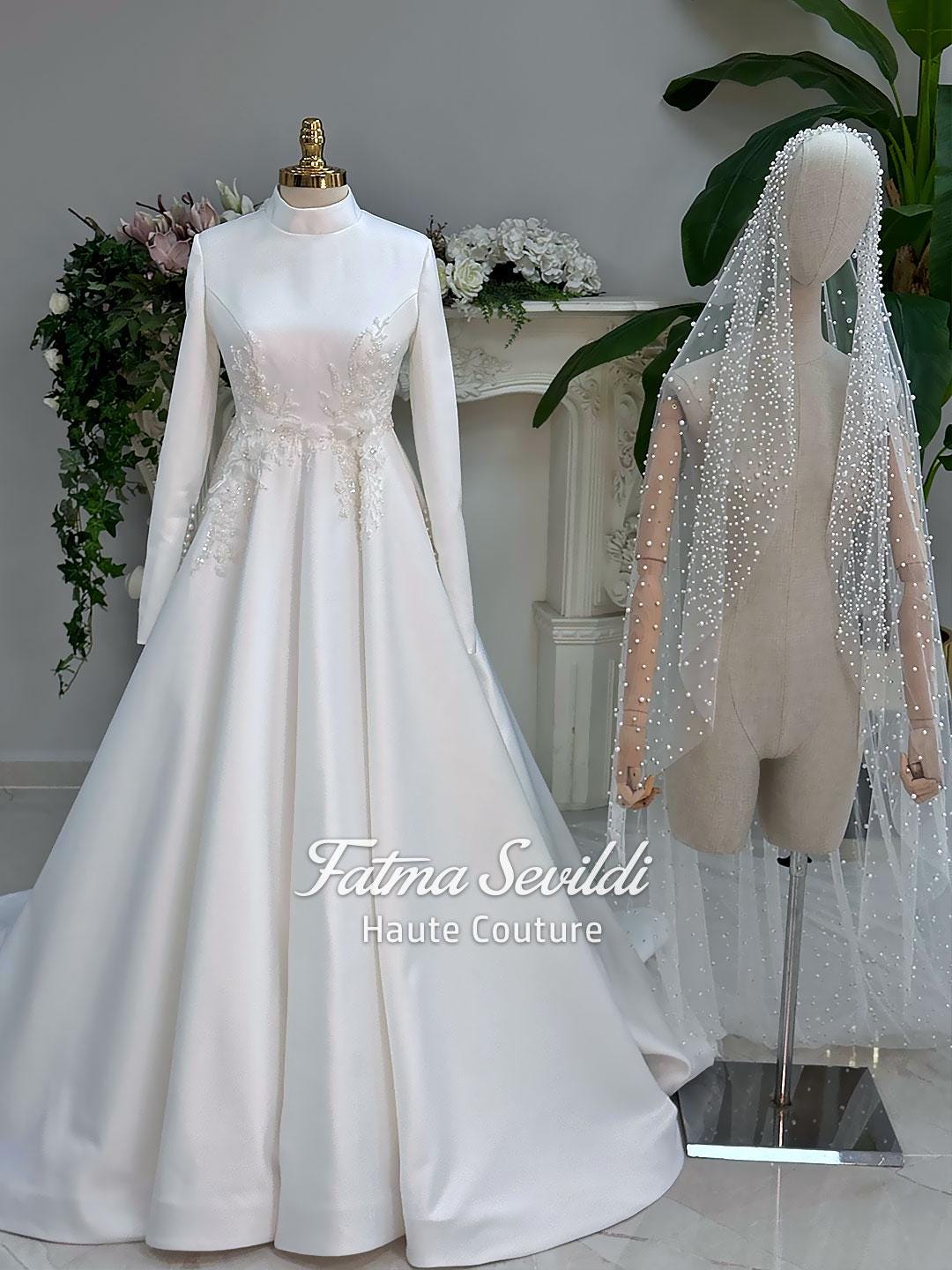 Elegant high-neck hijab wedding dress in white satin with long sleeves, lace embroidery, and beaded veil