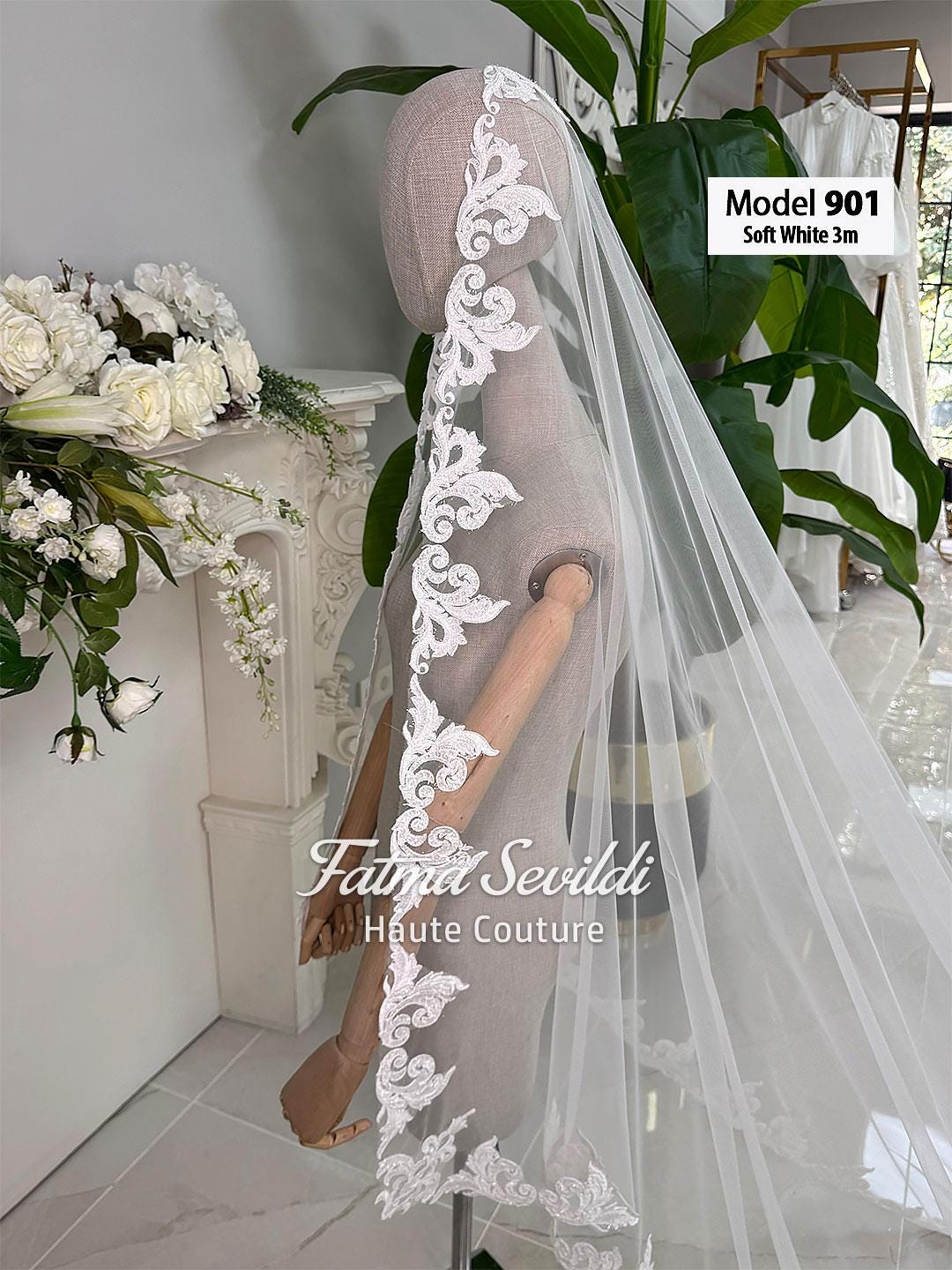 Soft white 3m hand-sewn beaded lace cathedral veil on mannequin