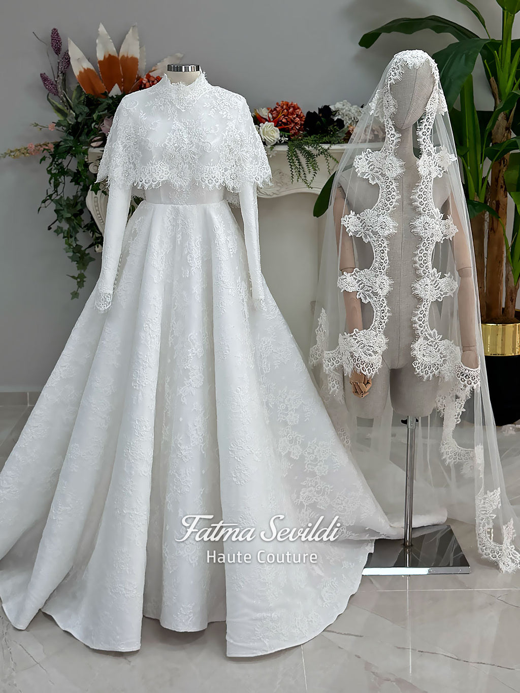 Elegant hijab wedding dress with long sleeves, high neck, detachable lace cape, cathedral train, and premium lace veil included. Luxury modest bridal couture gown in white with floral lace detailing.