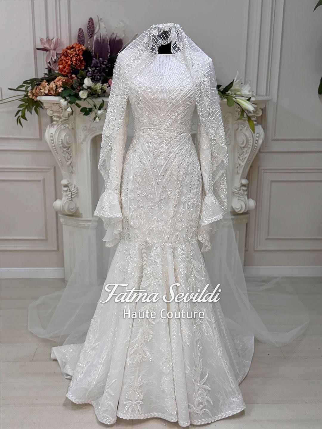 White beaded lace hijab wedding dress with long sleeves and veil