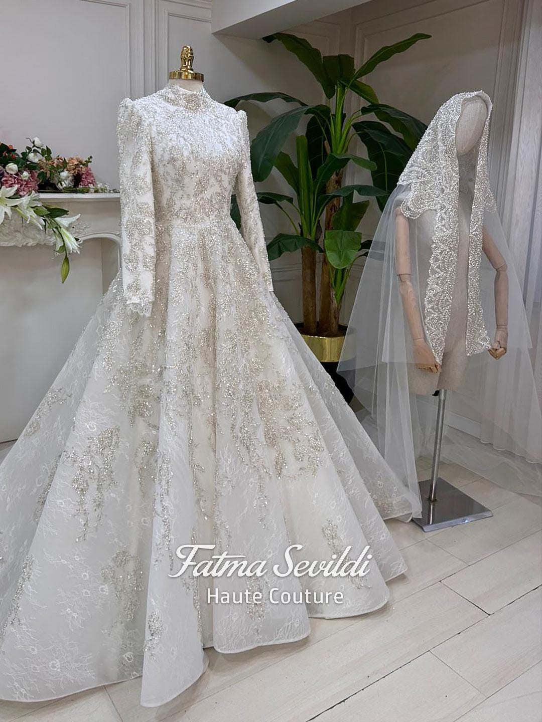 Veiled modest wedding dress with beaded lace, high neck, long sleeves