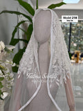 Ivory lace cathedral veil with floral embroidery, sequins, and hijab option
