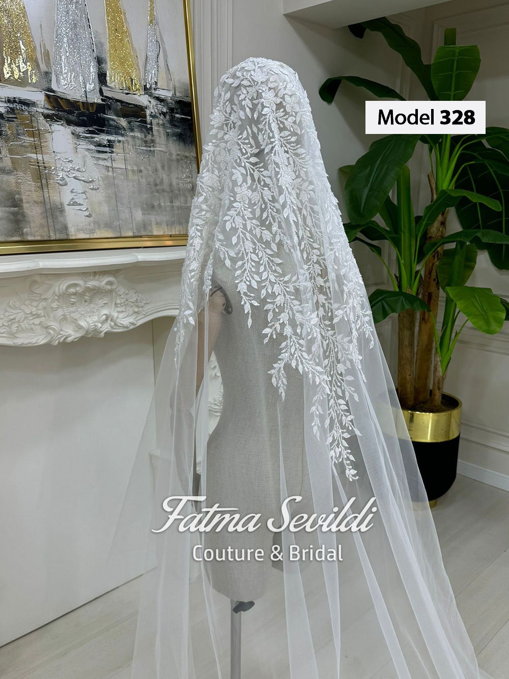 Delicate white lace bridal veil with floral embroidery on mannequin