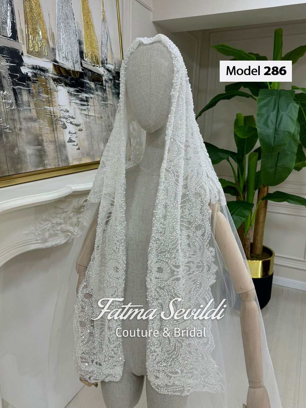 White lace mantilla cathedral veil with hand-sewn beaded detailing