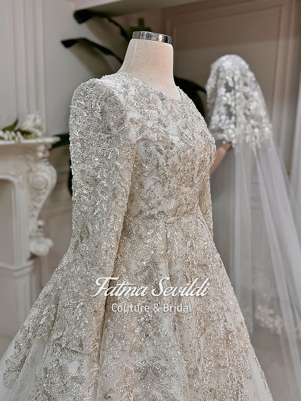 Shimmering ivory modest Muslim wedding gown with 3D beaded lace sleeves