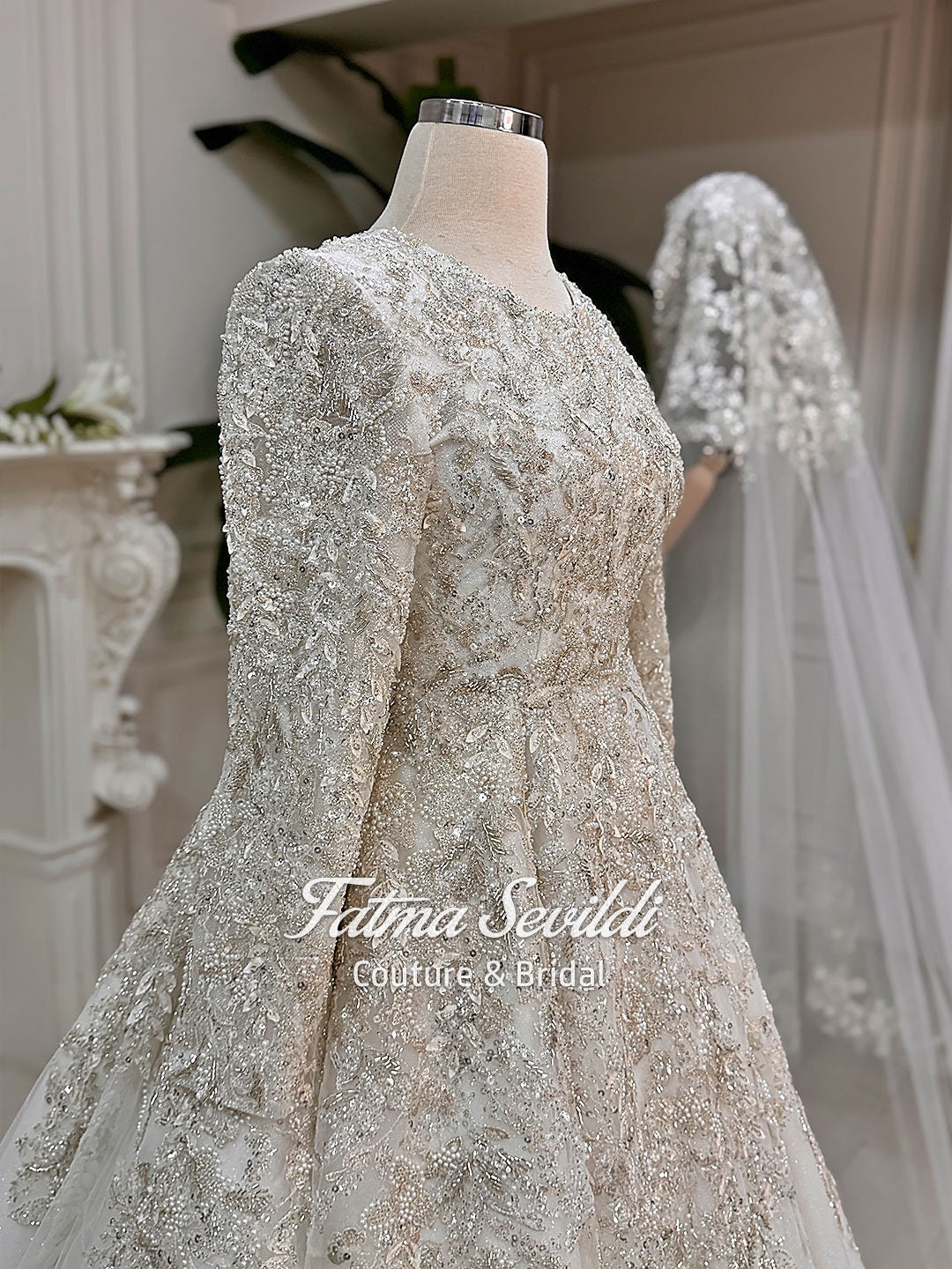 Shimmering ivory modest Muslim wedding gown with 3D beaded lace sleeves