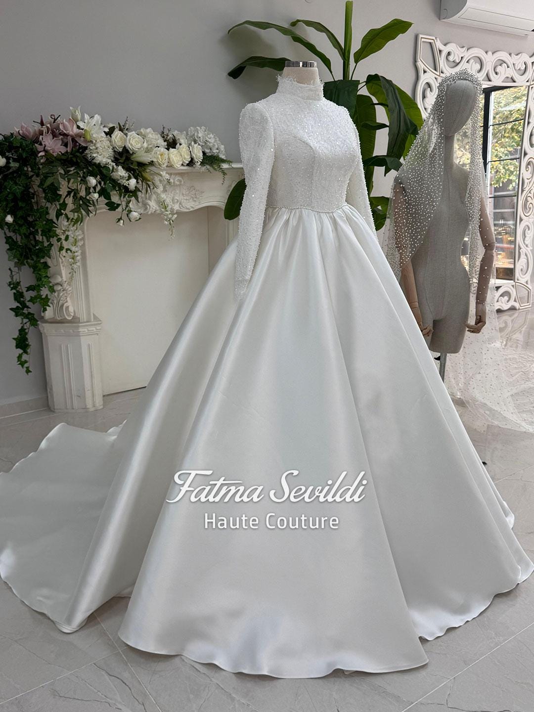 Elegant veiled hijab wedding dress with high neck, long sleeves, beaded satin bodice