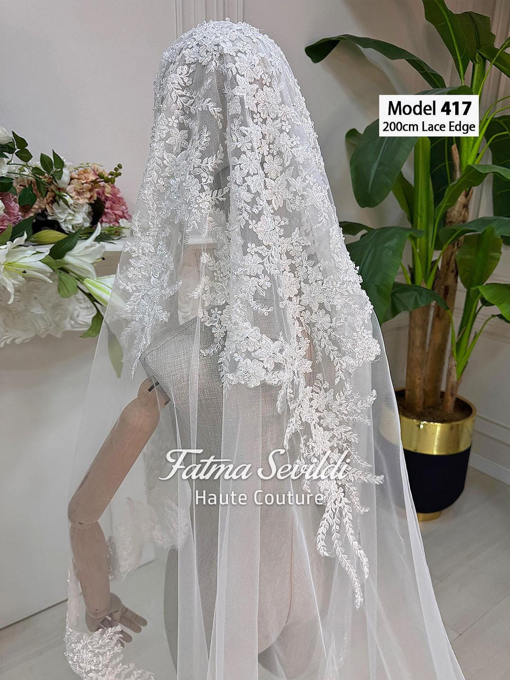 Delicate white lace cathedral veil with beaded floral embroidery by Fatma Sevildi