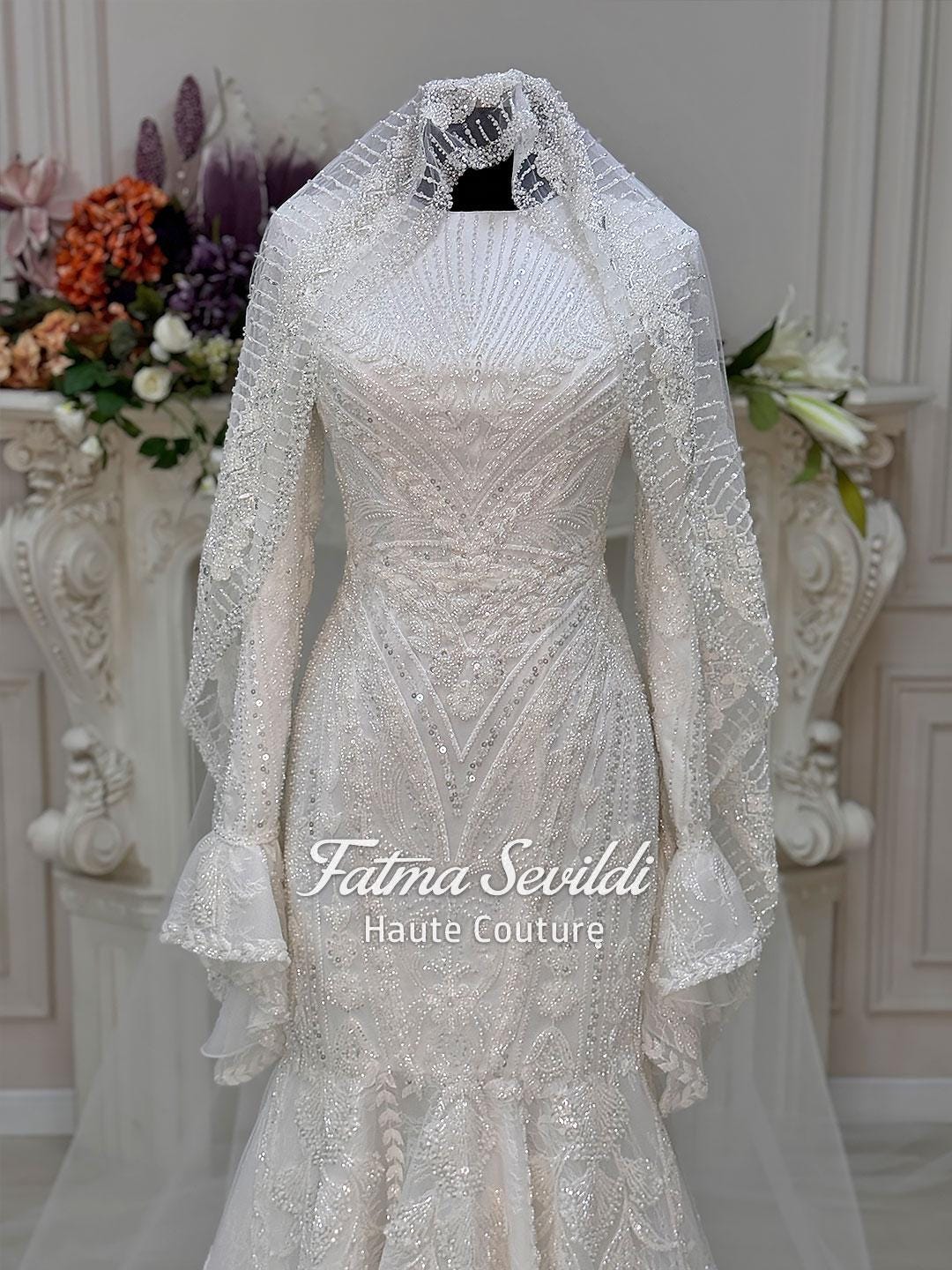 White beaded mermaid hijab wedding dress with long sleeves, lace veil by Fatma Sevildi