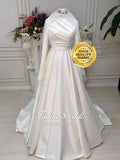 Elegant ivory satin Muslim wedding gown with high neck, long sleeves, lace veil