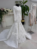 White beaded mermaid hijab wedding dress with long sleeves and high neck