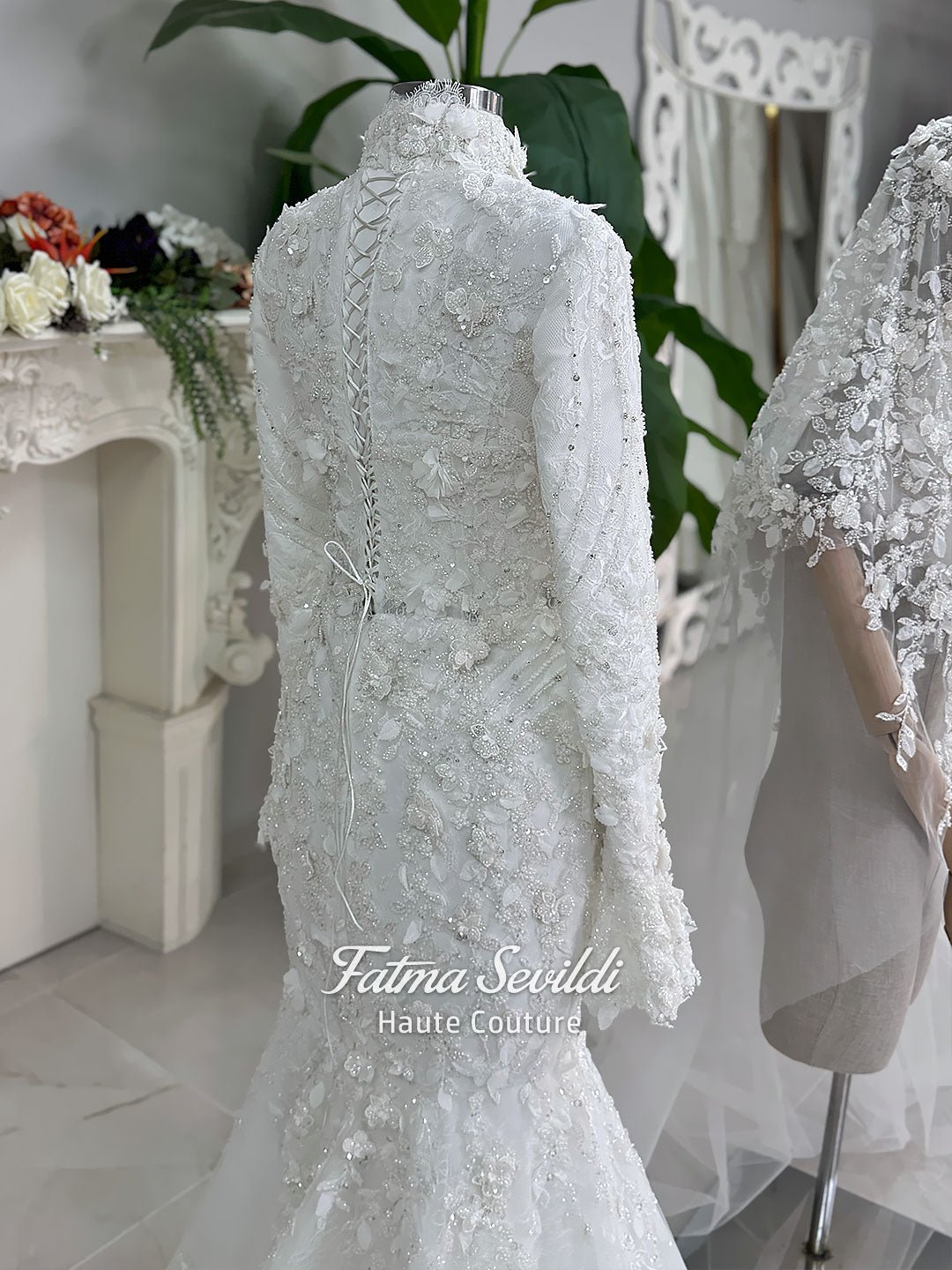3-in-1 white hijab wedding dress with a beaded mermaid gown, detachable overskirt and long sleeve high-neck bridal topper. Convertible modest bridal set with dimensional floral lace and a coordinating lace veil.