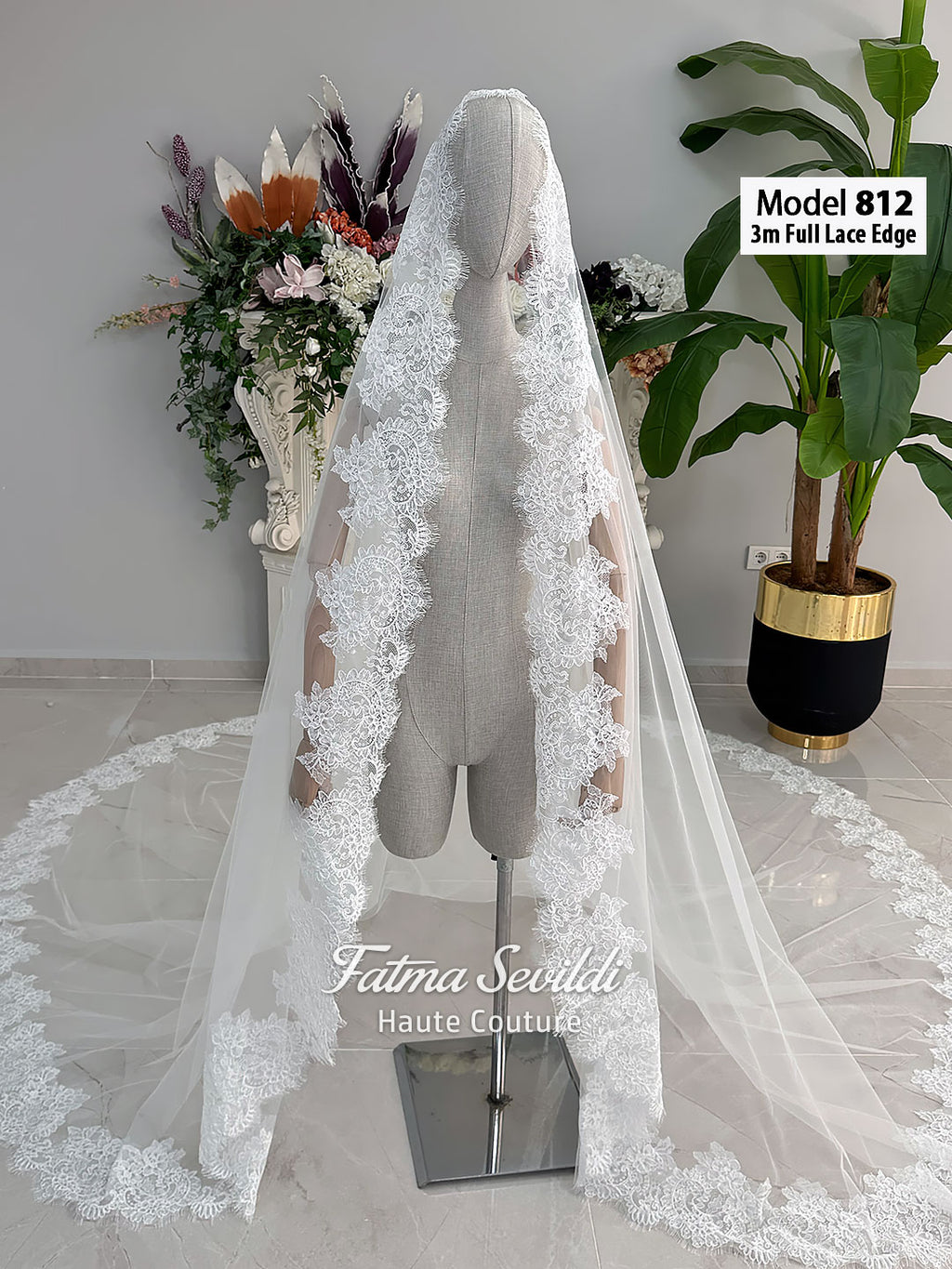 White A-line satin hijab wedding dress with long sleeves, high neckline, floral appliqué embroidery and an included premium lace mantilla veil for a modest Muslim bridal look.