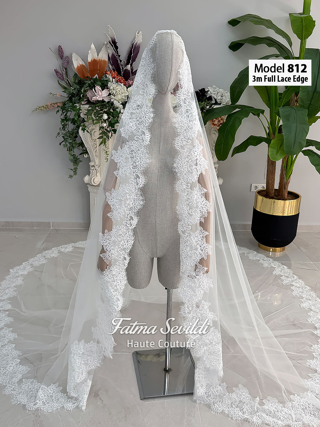 White A-line satin hijab wedding dress with long sleeves, high neckline, floral appliqué embroidery and an included premium lace mantilla veil for a modest Muslim bridal look.