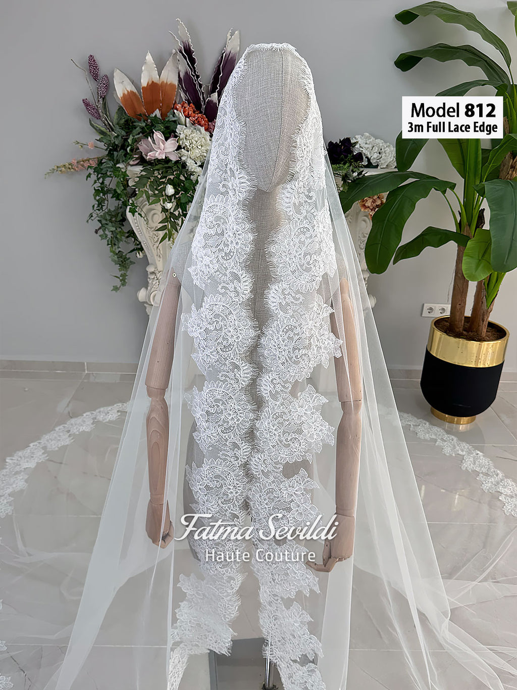 White A-line satin hijab wedding dress with long sleeves, high neckline, floral appliqué embroidery and an included premium lace mantilla veil for a modest Muslim bridal look.