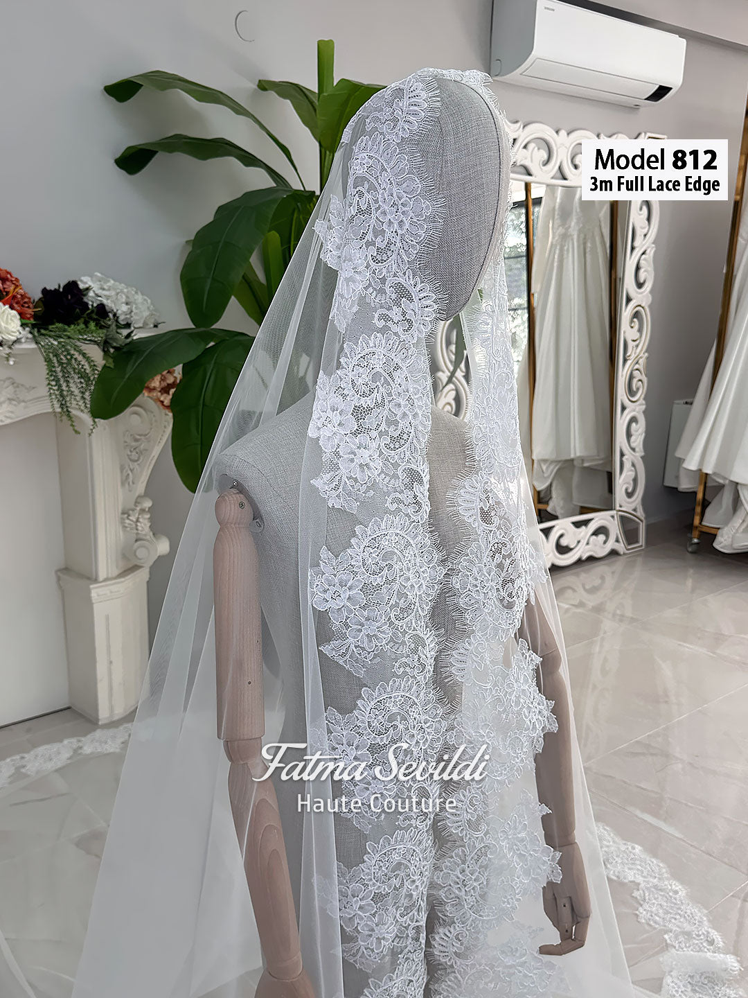 White A-line satin hijab wedding dress with long sleeves, high neckline, floral appliqué embroidery and an included premium lace mantilla veil for a modest Muslim bridal look.