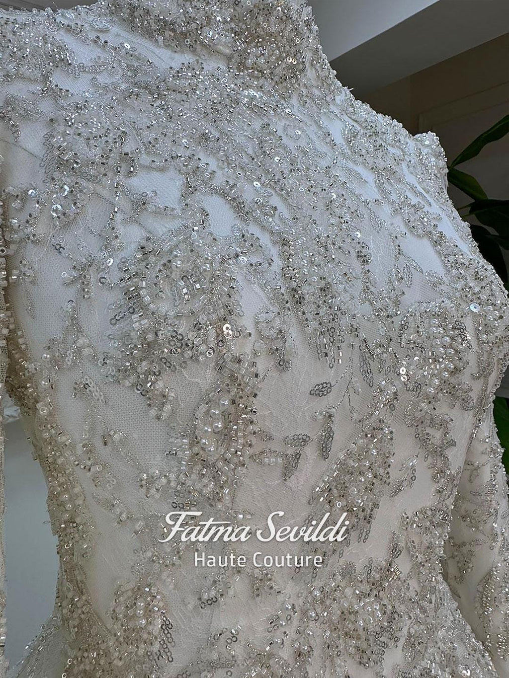 Veiled modest wedding dress with silver beaded floral bodice