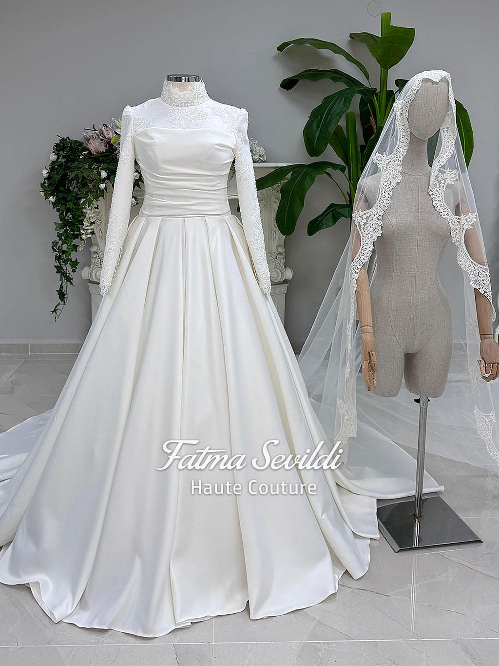 White satin veiled hijab wedding dress with high neck, long sleeves, lace details