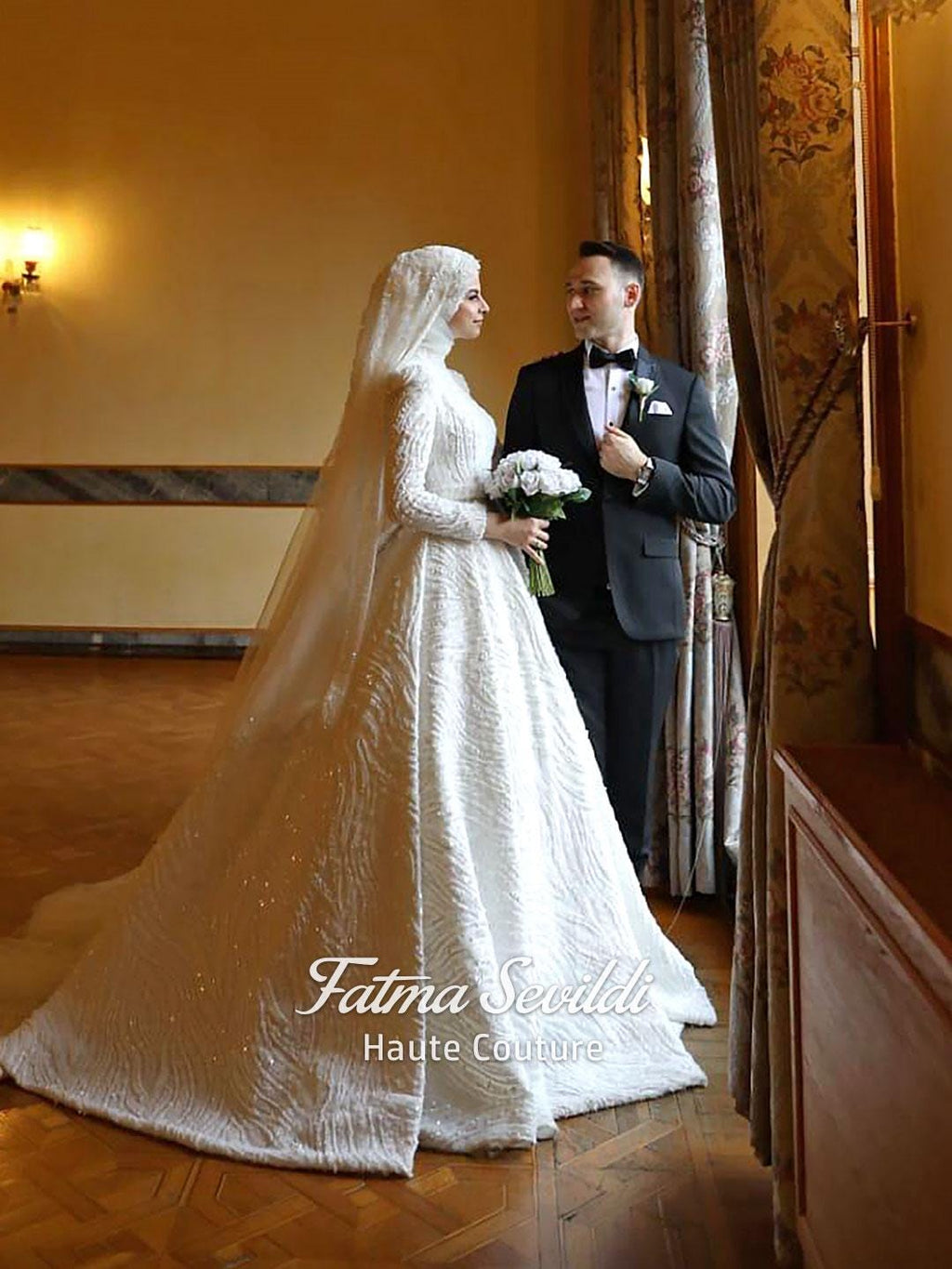 White A-line hijab wedding dress with beaded lace long sleeves and veil