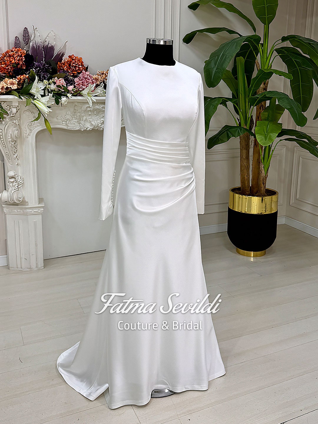 Veiled satin Muslim wedding dress with long sleeves and modest fit