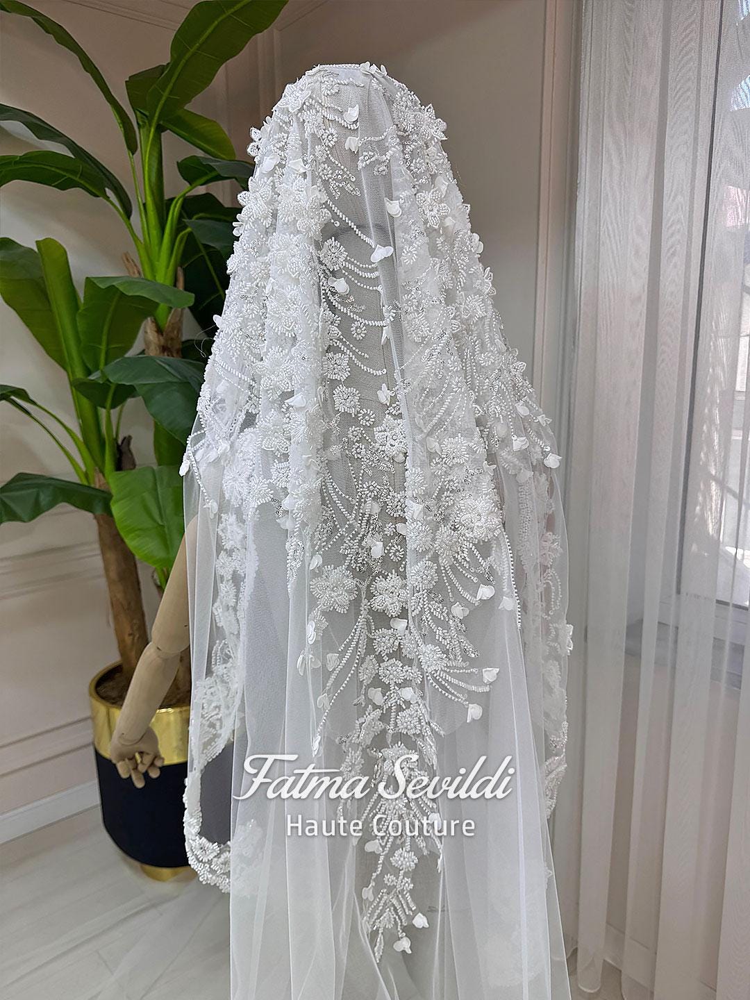 Delicate white lace bridal veil with floral embroidery on mermaid hijab gown