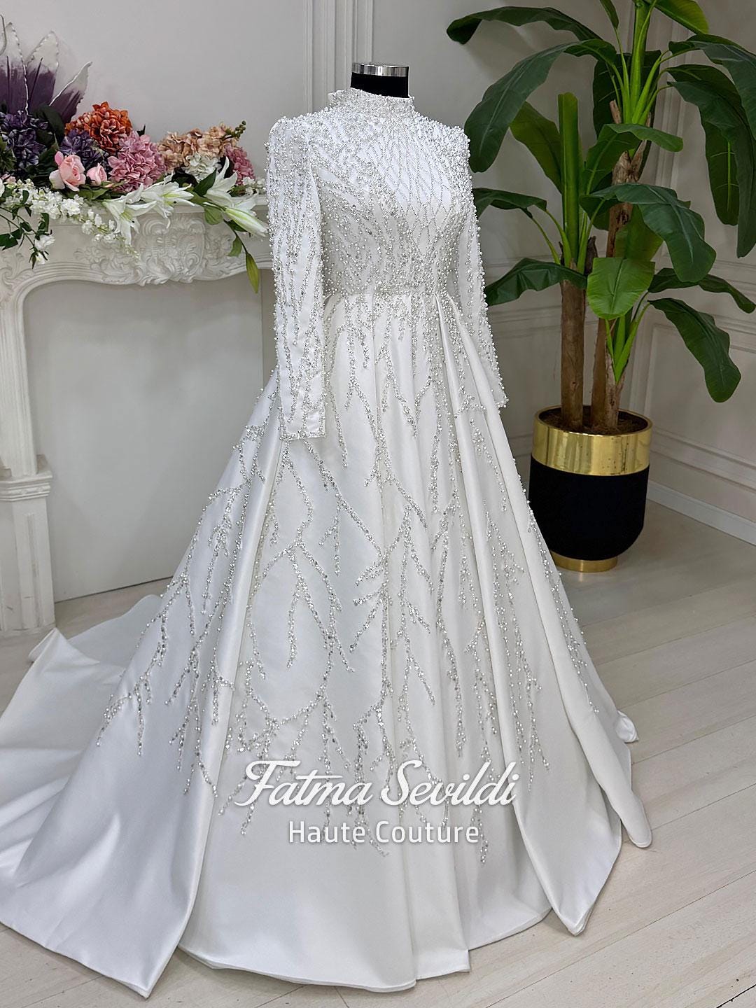 Elegant high neck beaded lace long sleeve A-line wedding gown with silver branch patterns