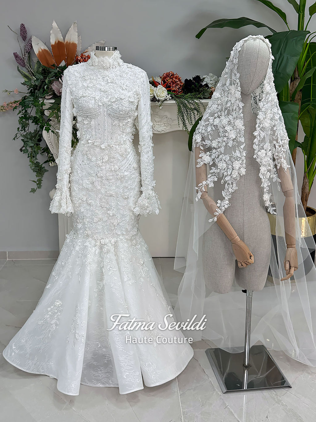 3-in-1 white hijab wedding dress with a beaded mermaid gown, detachable overskirt and long sleeve high-neck bridal topper. Convertible modest bridal set with dimensional floral lace and a coordinating lace veil.